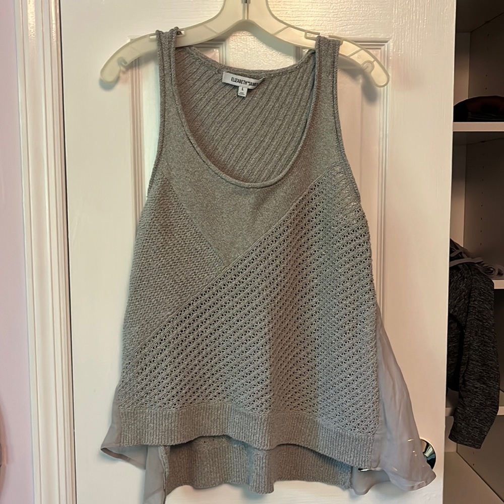 Elizabeth and James size large sweater with size mesh detail.